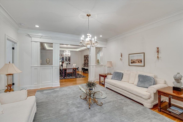 living room with hardwood / wood-style flooring and ornamental molding