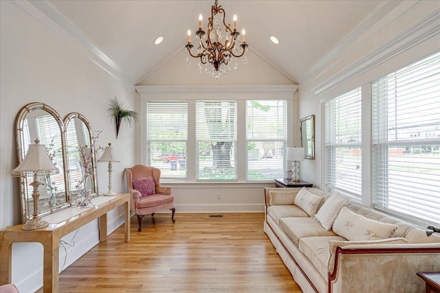 interior space with a chandelier and lofted ceiling