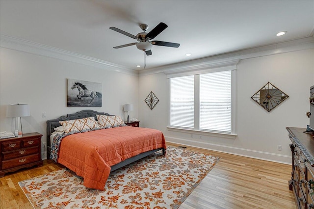 bedroom featuring light wood-type flooring, ceiling fan, and ornamental molding