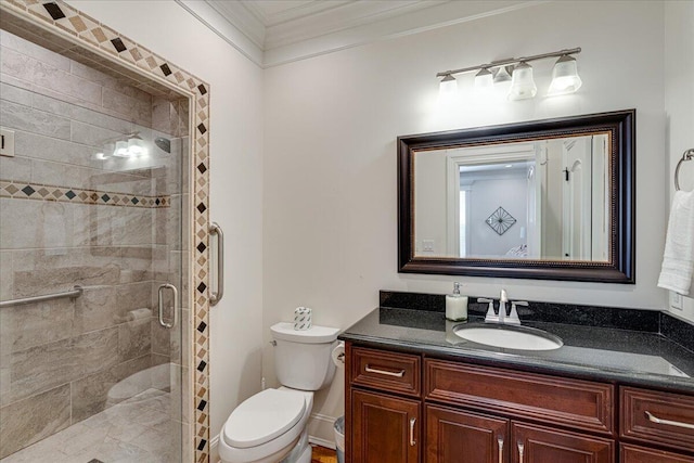 bathroom featuring vanity, toilet, an enclosed shower, and crown molding