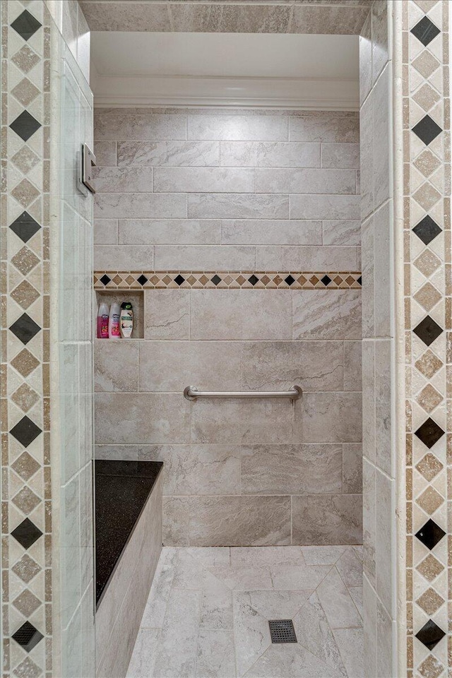 bathroom featuring tiled shower