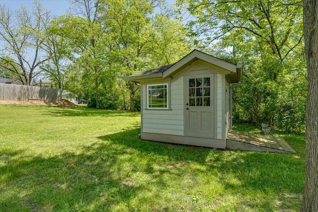 view of outdoor structure featuring a yard