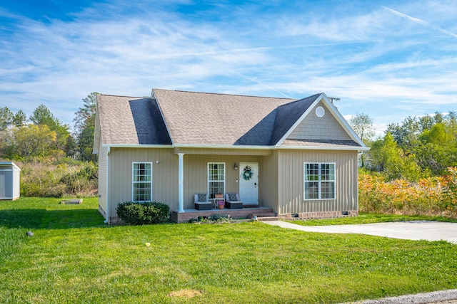 view of front of property with a front yard and a porch