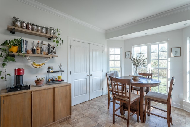 dining space featuring ornamental molding