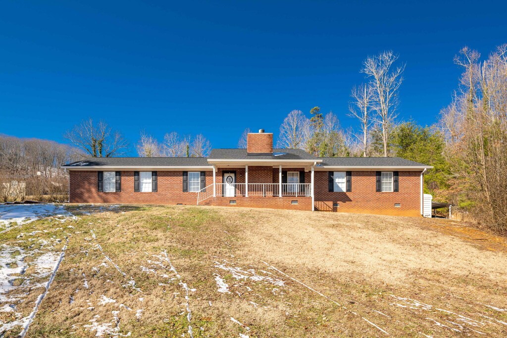 ranch-style home with covered porch