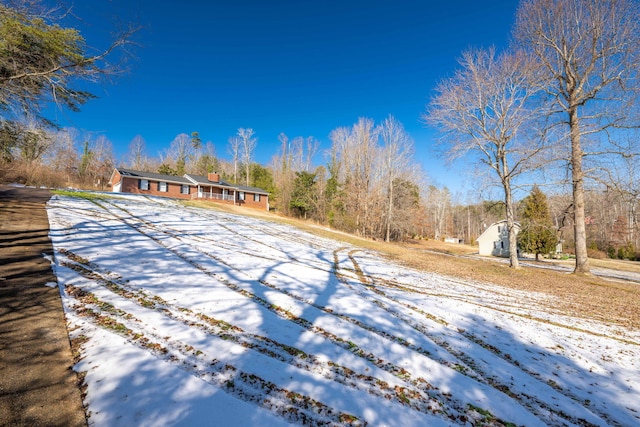 view of snow covered property