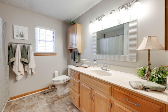 bathroom with a textured ceiling, a shower with curtain, vanity, and toilet