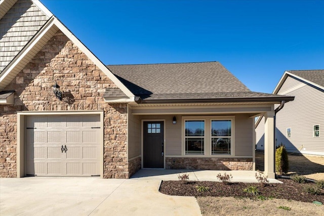 view of front of property featuring a garage and a porch