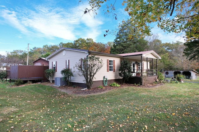 view of front of house with a front yard and covered porch