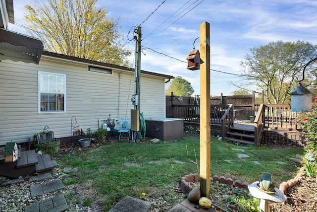 view of yard with a wooden deck