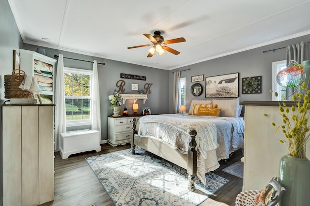 bedroom with ceiling fan, dark hardwood / wood-style flooring, and ornamental molding