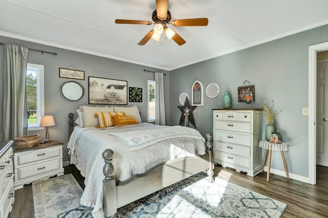 bedroom featuring ornamental molding, ceiling fan, and dark hardwood / wood-style floors