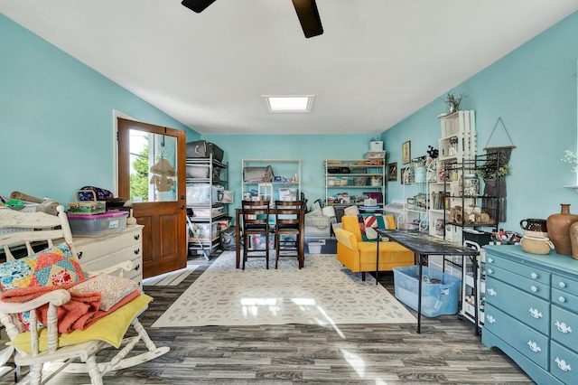 home office with dark wood-type flooring and ceiling fan