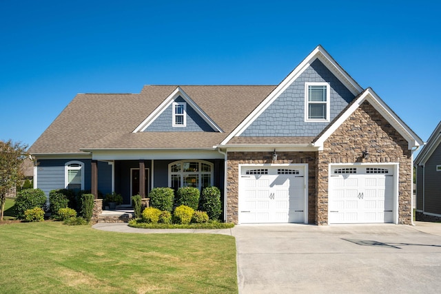 view of front of property featuring a garage and a front lawn