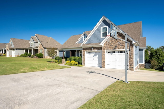 view of front of house featuring a garage and a front lawn