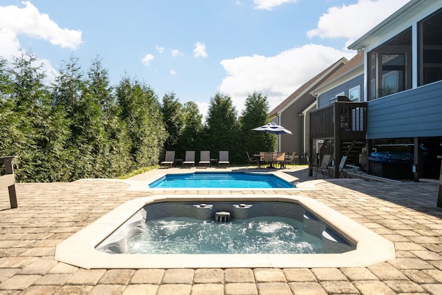 view of swimming pool featuring a patio area