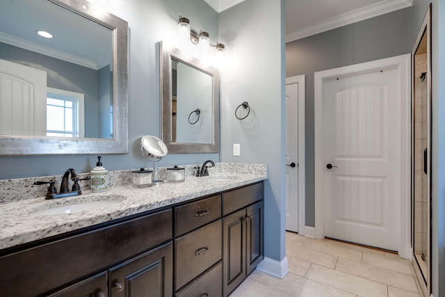 bathroom featuring tile patterned flooring, vanity, a shower with shower door, and crown molding