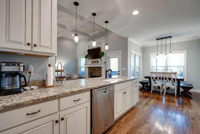 kitchen featuring dishwasher, dark hardwood / wood-style flooring, plenty of natural light, and sink