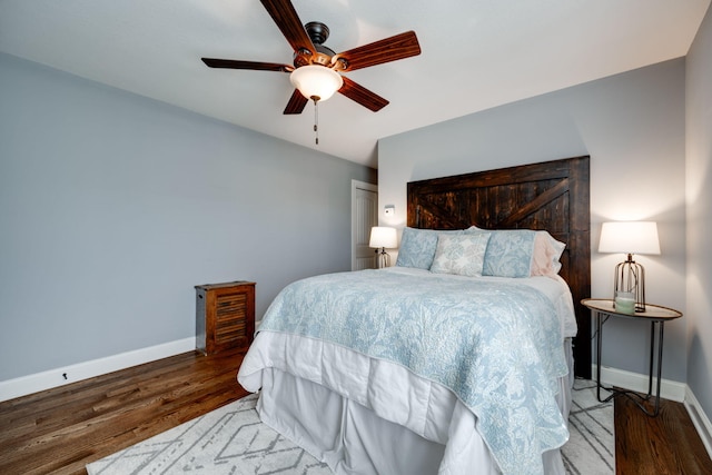 bedroom featuring ceiling fan and dark wood-type flooring