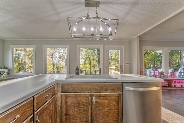 kitchen with light hardwood / wood-style floors, a textured ceiling, sink, ornamental molding, and stainless steel dishwasher