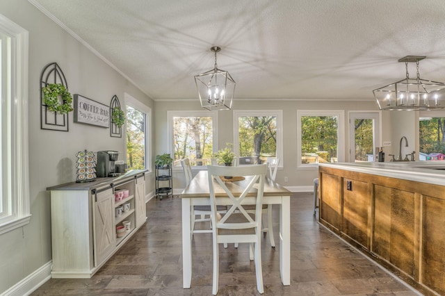 sunroom with a notable chandelier and sink