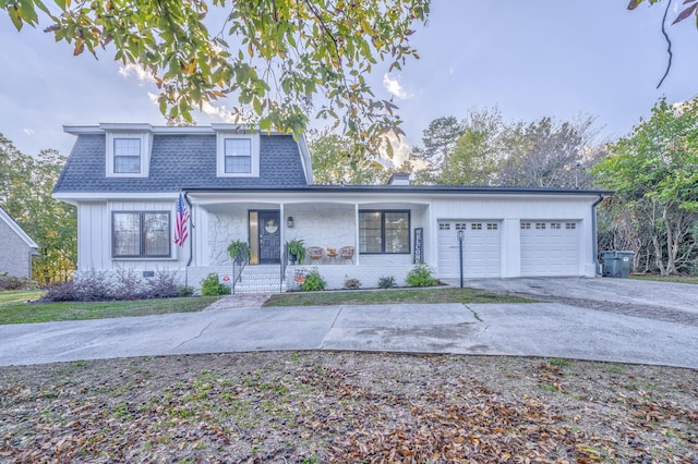 front of property with a garage and a porch