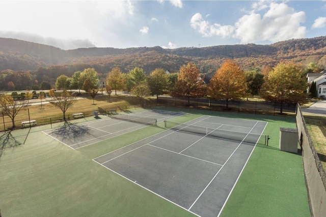 view of sport court with a mountain view