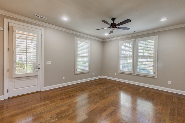 spare room with dark hardwood / wood-style floors, ceiling fan, and ornamental molding