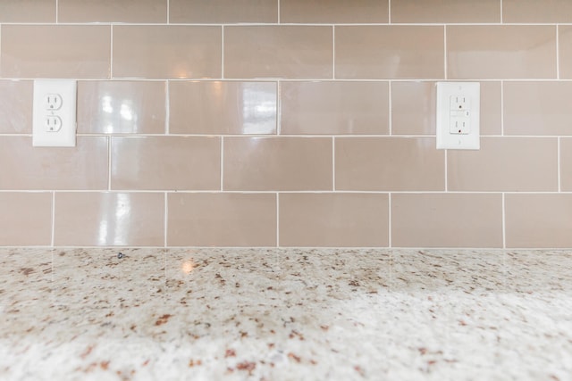 interior details featuring decorative backsplash