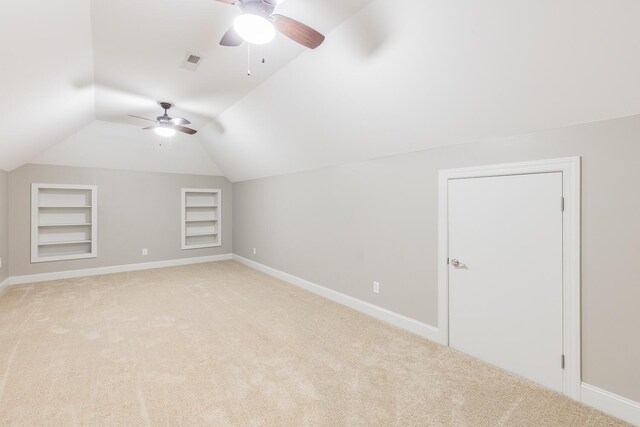 8556 Festival Loop, Chattanooga, TN 37419 - additional living space featuring built in shelves, a ceiling fan, light colored carpet, and vaulted ceiling