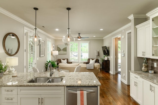 kitchen with white cabinetry, sink, dark wood-type flooring, and light stone counters