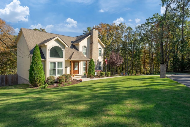 front facade with a front yard