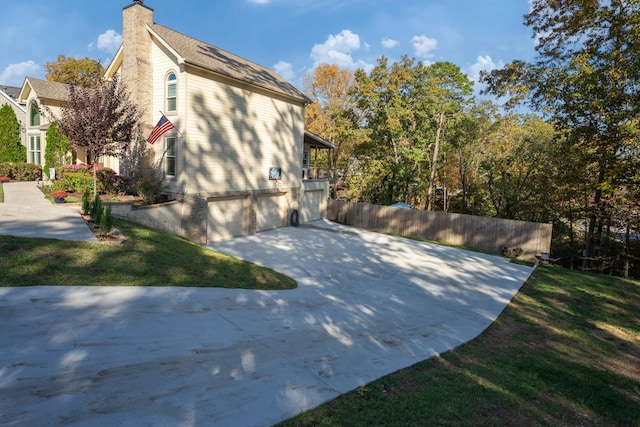 view of property exterior featuring a garage