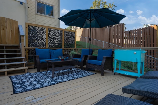 wooden terrace featuring an outdoor living space