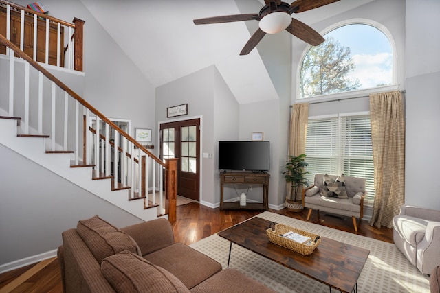 living room featuring high vaulted ceiling, ceiling fan, and dark wood-type flooring