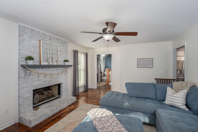 living room featuring a fireplace, ceiling fan, and dark hardwood / wood-style flooring