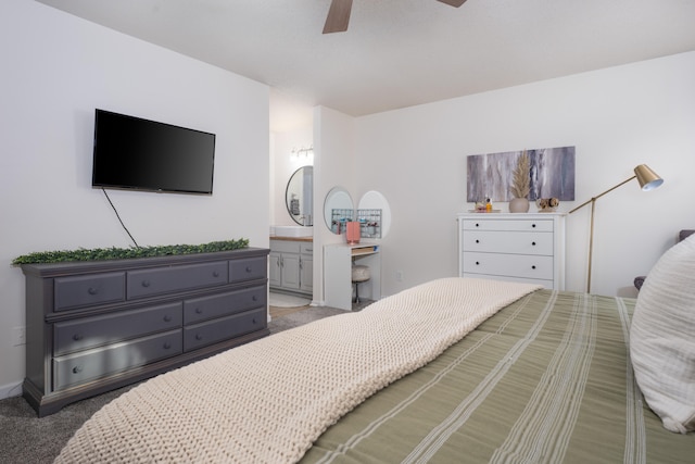 bedroom with connected bathroom, ceiling fan, and carpet