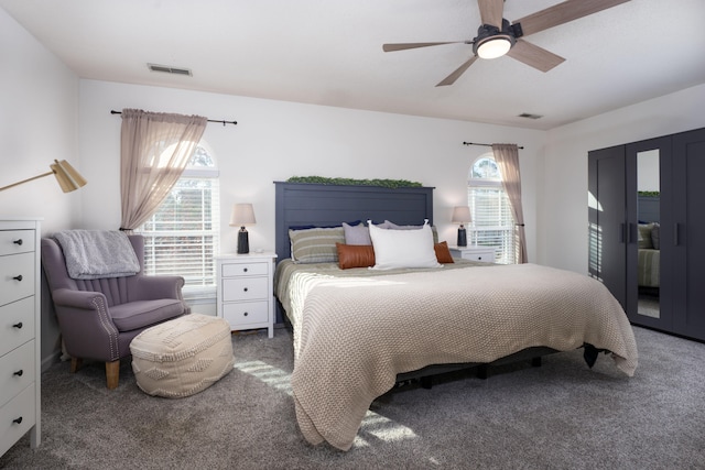 carpeted bedroom featuring ceiling fan