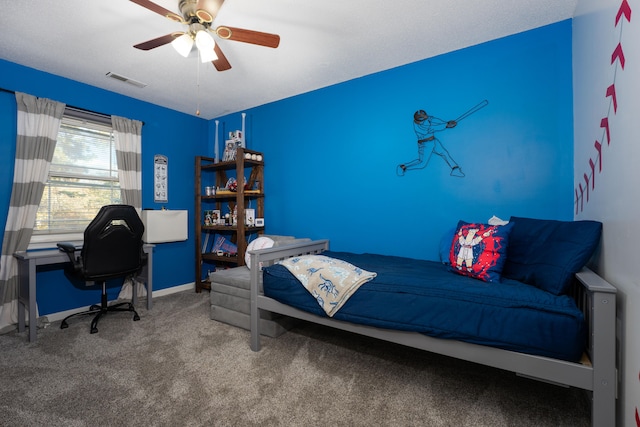 bedroom with ceiling fan and carpet floors