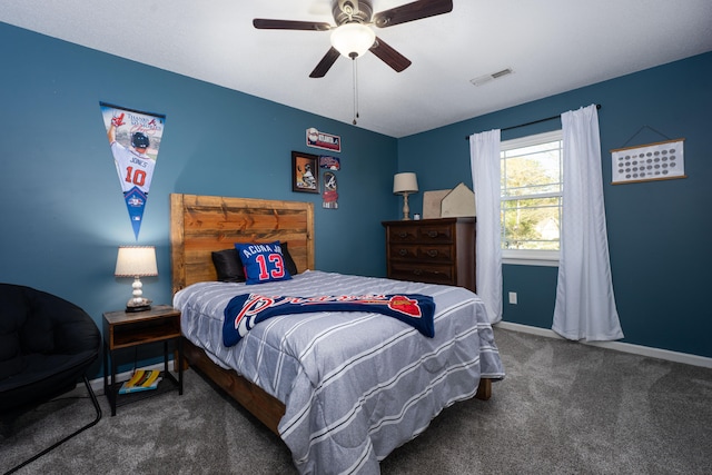 bedroom featuring dark carpet and ceiling fan