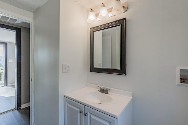 bathroom featuring vanity and wood-type flooring