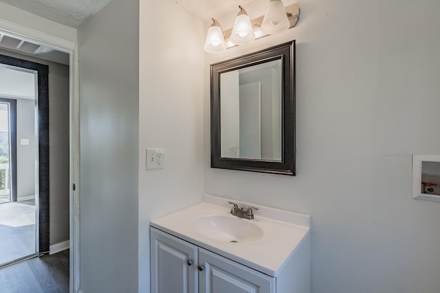 bathroom with vanity and wood-type flooring