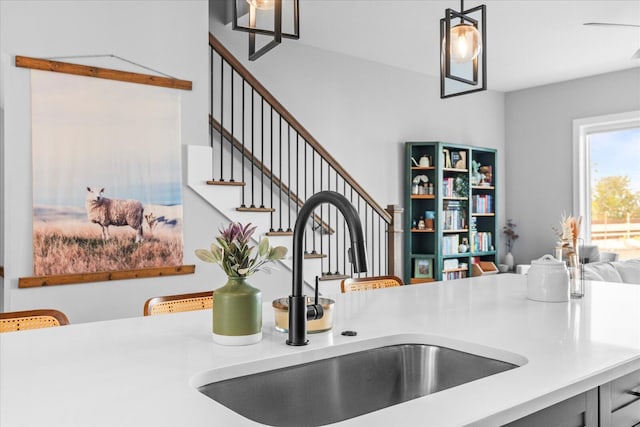 kitchen featuring decorative light fixtures and sink