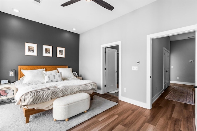 bedroom featuring ceiling fan and dark wood-type flooring