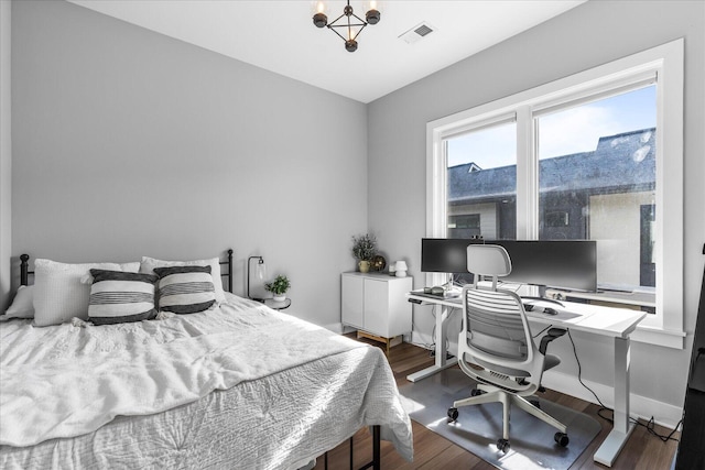 bedroom with wood-type flooring