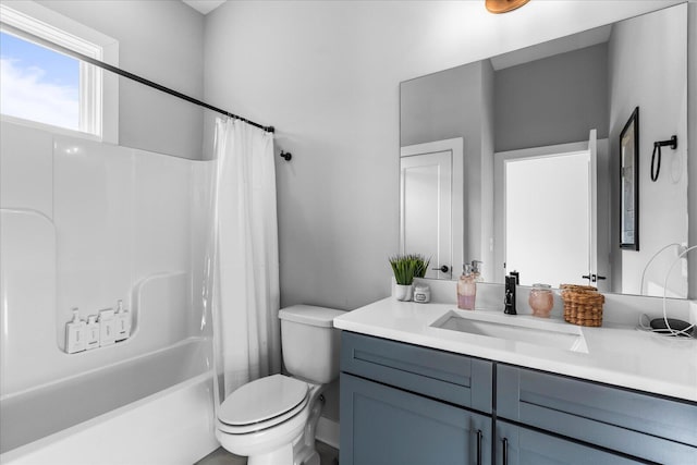 full bathroom featuring vanity, toilet, and shower / tub combo with curtain