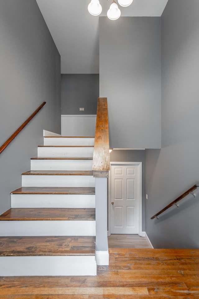 stairs with hardwood / wood-style floors