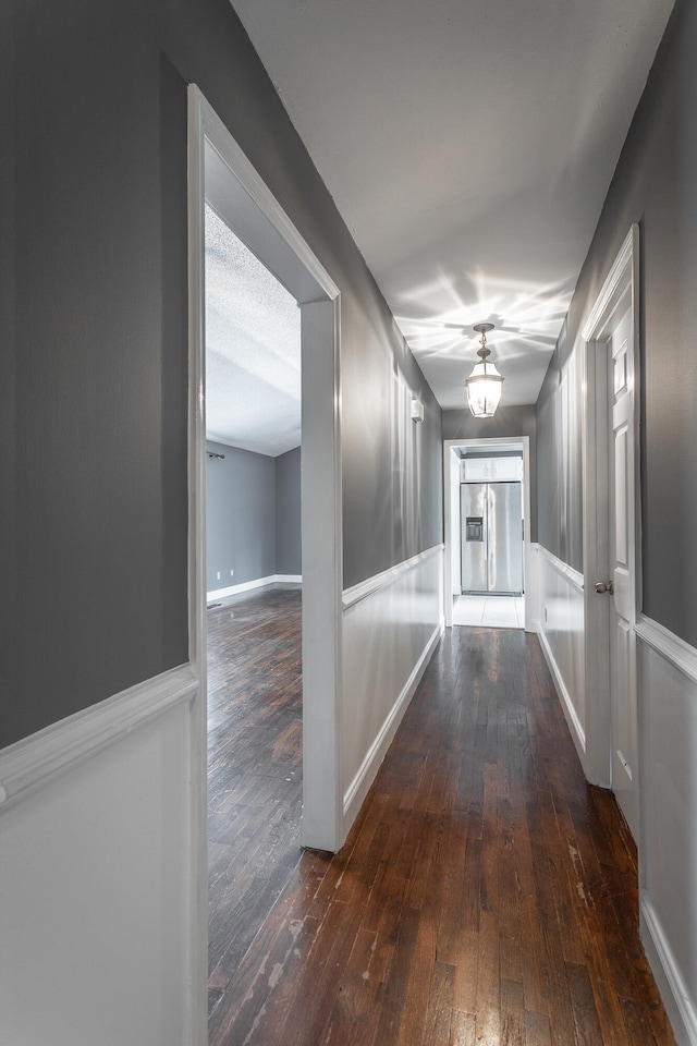 hall with dark wood-type flooring