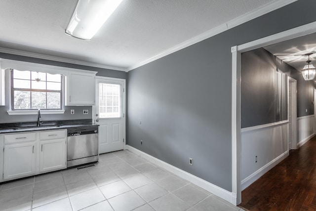 kitchen featuring white cabinetry, dishwasher, crown molding, and sink