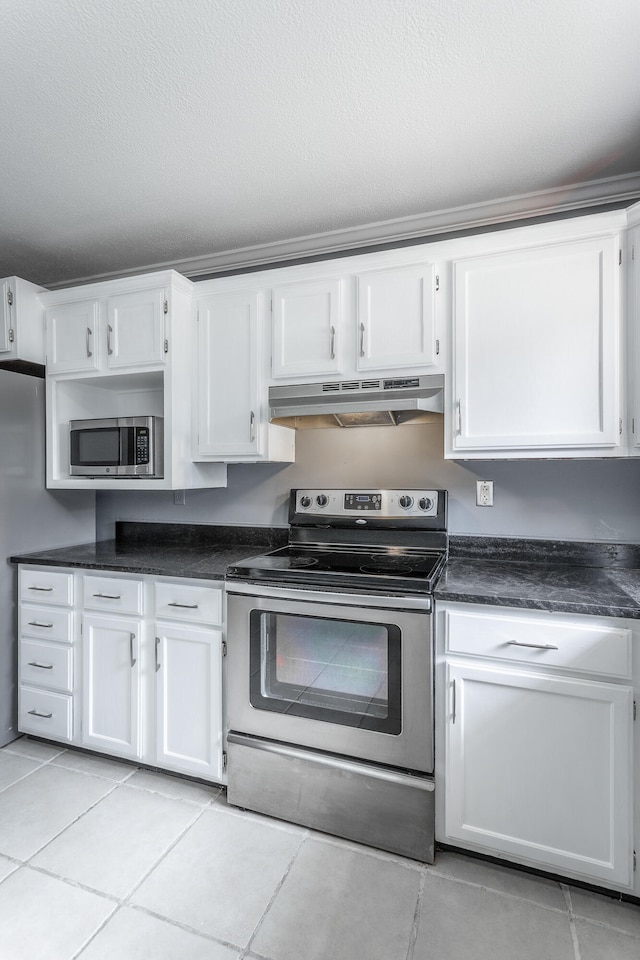 kitchen featuring white cabinetry, stainless steel appliances, extractor fan, a textured ceiling, and light tile patterned floors